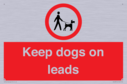 dogs-on-lead-symbol-with-black-text-on-white-background~